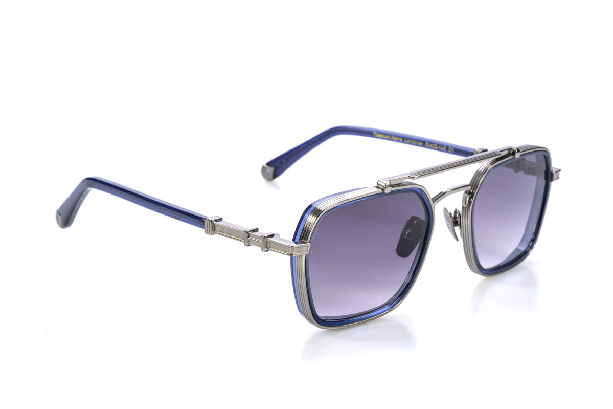 Londoner, gli occhiali da sole in titanio, dalla forma squadrata con dettagli in acetato, sono l'espressione di uno stile moderno e sofisticato.